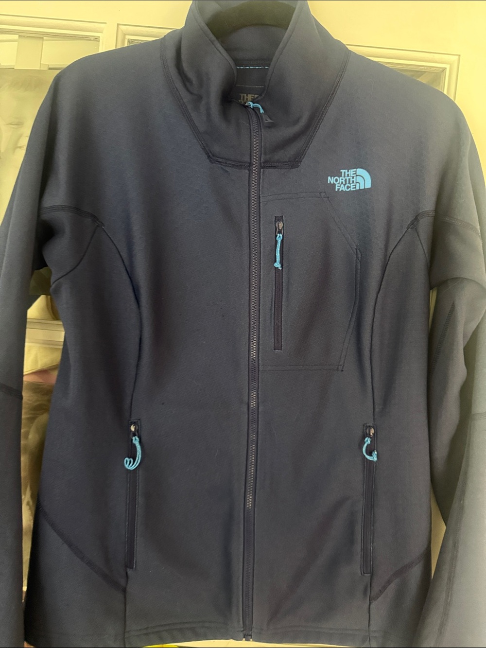 The North Face Women's Navy Blue Softshell Jacket with Aqua Accents